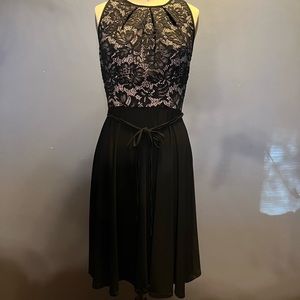 Beautiful formal dress black with tan inset with black lace.
